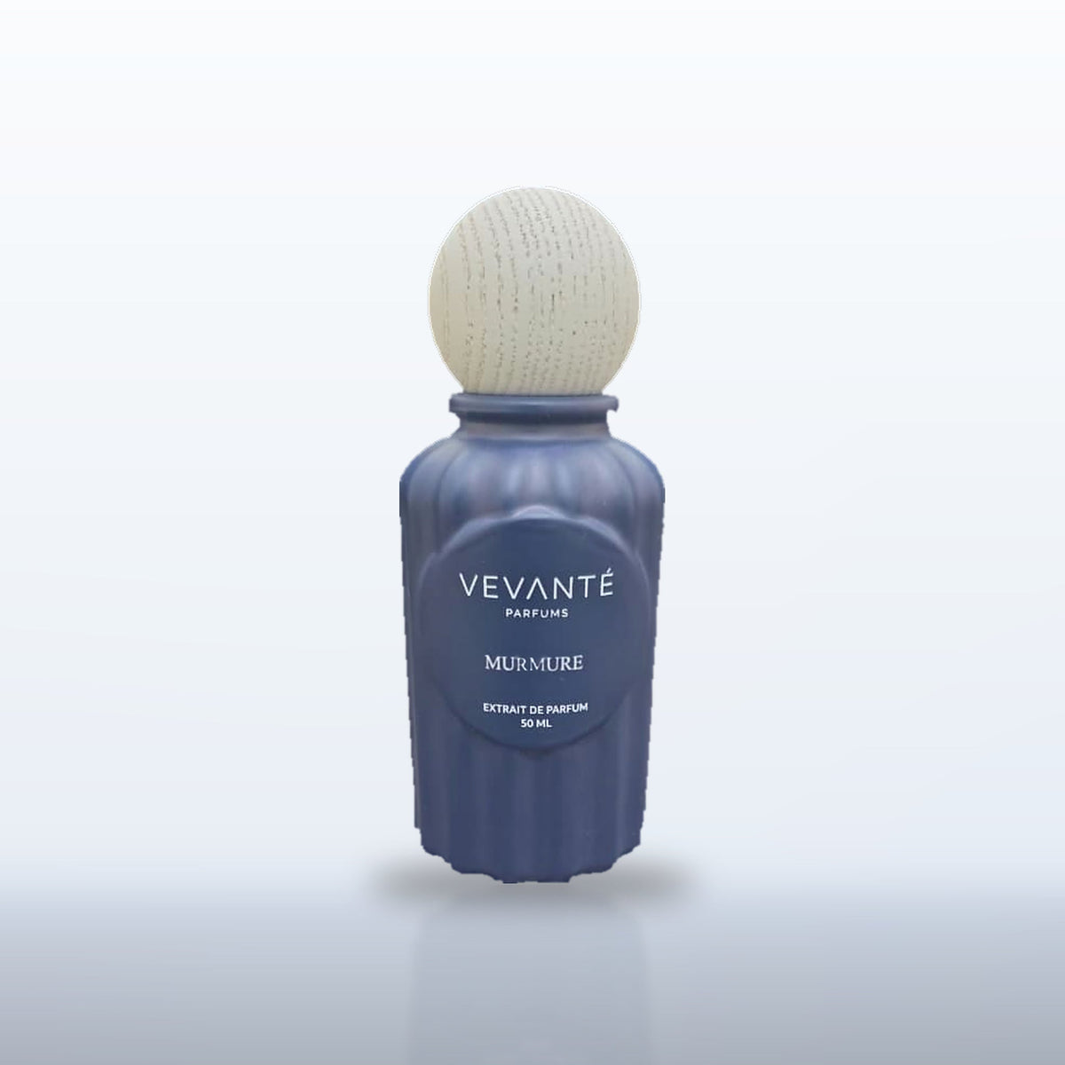 Vevanté Murmure 50 ml Extrait de Parfum on a soft navy studio backdrop