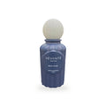 Vevanté Murmure 50 ml Extrait de Parfum — matte navy bottle with wooden sphere cap